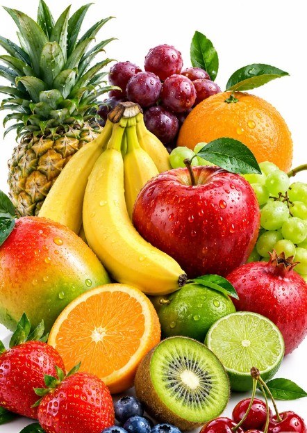 Fresh mixed fruit: pineapple, grapes, orange, apple, bananas, mango, kiwi, limes and strawberries